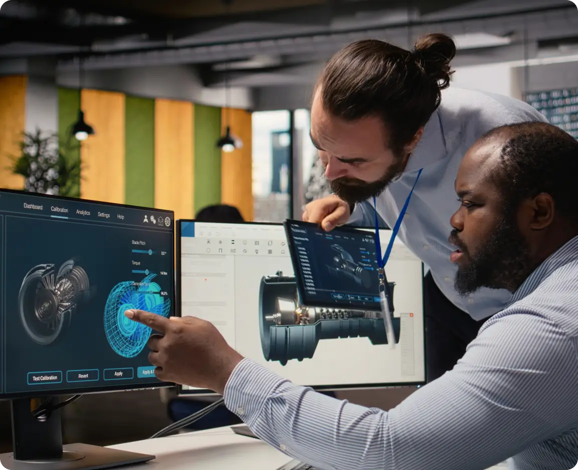 Engineers analyzing 3D engine model