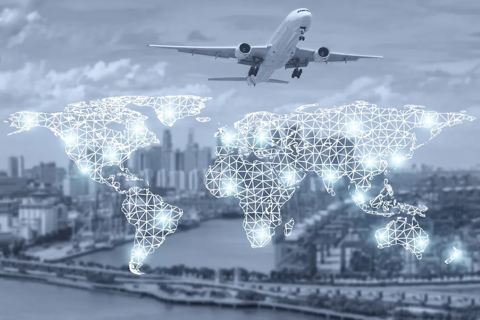 Airplane over city with glowing world map